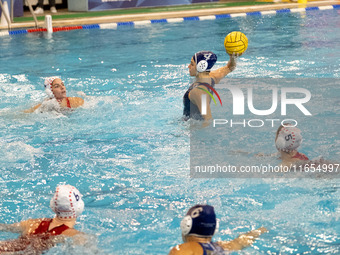 Eleni Beta (4) is seen in action during the match Olympiacos vs. National Piraeus during the Final Water Polo Super Cup at Papastrateio Swim...