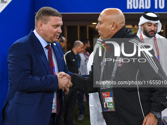 Qatar National team head coach Bartolome Marquez and Kyrgyzstan National team head coach Maksim Lisitsyn shake hands prior to kick-off ahead...