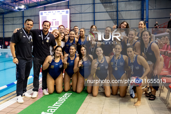 The National Piraeus team poses for a photo after the match Olympiacos vs. National Piraeus during the Final Water Polo Super Cup at Papastr...