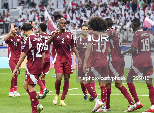 Almoez Ali (R) of Qatar celebrates with teammates after scoring the opening goal during the FIFA World Cup 2026 AFC Asian Qualifiers 3rd rou...