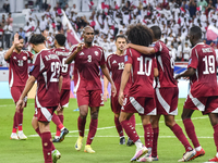 Almoez Ali (R) of Qatar celebrates with teammates after scoring the opening goal during the FIFA World Cup 2026 AFC Asian Qualifiers 3rd rou...