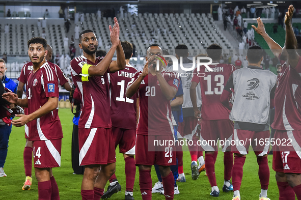 Players of Qatar celebrate after winning the FIFA World Cup 2026 AFC Asian Qualifiers 3rd round group A match between Qatar and Kyrgyzstan a...