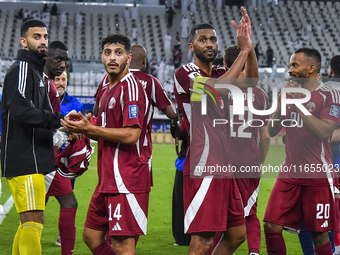 Players of Qatar celebrate after winning the FIFA World Cup 2026 AFC Asian Qualifiers 3rd round group A match between Qatar and Kyrgyzstan a...