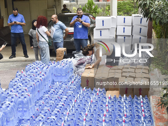 Distribution of rations from UNICEF and the Ministry of Social Affairs occurs in schools for displaced people in Beirut, Lebanon, on October...