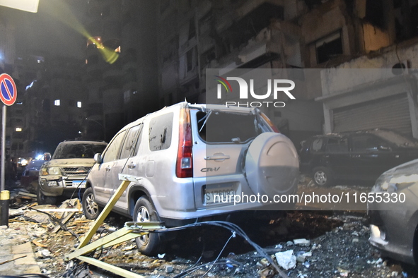 Teams conduct search and rescue operations at the scene after the Israeli army launches an airstrike on the Nowayri area of Beirut, Lebanon,...