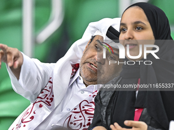 Qatar supporters cheer for their team during the FIFA World Cup 2026 AFC Asian Qualifiers 3rd round group A match between Qatar and Kyrgyzst...