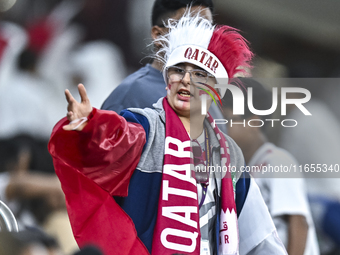 A fan from Qatar cheers for their team before the FIFA World Cup 2026 AFC Asian Qualifiers 3rd round group A match between Qatar and Kyrgyzs...