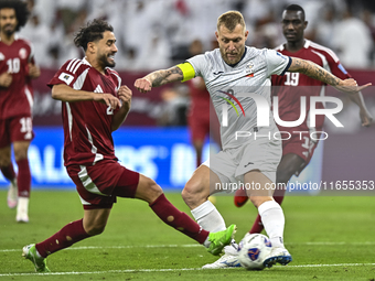 Abdelrahman Fahmi Moustafa of Qatar battles for the ball with Kichin Valerii of Kyrgyzstan during the FIFA World Cup 2026 AFC Asian Qualifie...