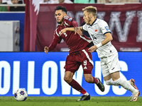 Edmilson Junior Dasilva (L) of Qatar battles for the ball with Aleksandr Mishchenko (R) of Kyrgyzstan during the FIFA World Cup 2026 AFC Asi...