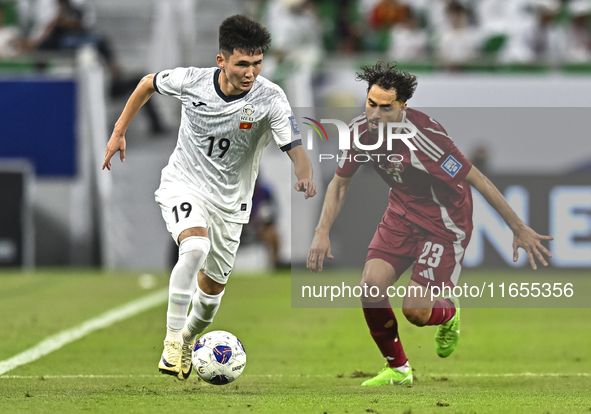 Abdelrahman Fahmi Moustafa of Qatar battles for the ball with Ermek Kenzhebaev of Kyrgyzstan during the FIFA World Cup 2026 AFC Asian Qualif...