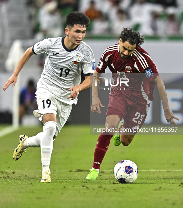 Abdelrahman Fahmi Moustafa of Qatar battles for the ball with Ermek Kenzhebaev of Kyrgyzstan during the FIFA World Cup 2026 AFC Asian Qualif...