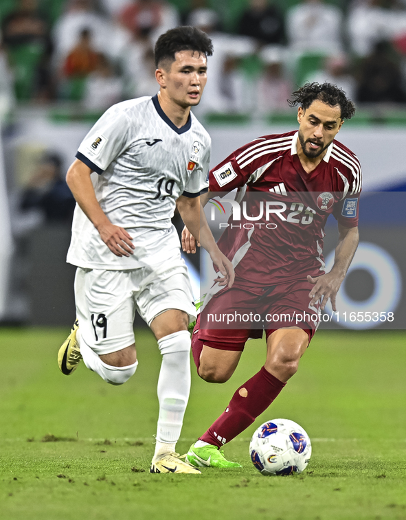 Abdelrahman Fahmi Moustafa of Qatar battles for the ball with Ermek Kenzhebaev of Kyrgyzstan during the FIFA World Cup 2026 AFC Asian Qualif...