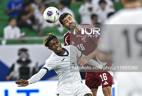 Boualem Khoukhi of Qatar battles for the ball with Joel Kojo of Kyrgyzstan during the FIFA World Cup 2026 AFC Asian Qualifiers 3rd round gro...