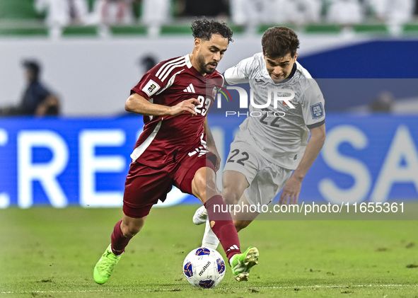 Abdelrahman Fahmi Moustafa of Qatar battles for the ball with Alimardo Shukurov of Kyrgyzstan during the FIFA World Cup 2026 AFC Asian Quali...