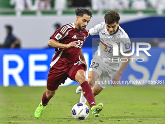 Abdelrahman Fahmi Moustafa of Qatar battles for the ball with Alimardo Shukurov of Kyrgyzstan during the FIFA World Cup 2026 AFC Asian Quali...