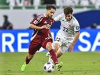 Abdelrahman Fahmi Moustafa of Qatar battles for the ball with Alimardo Shukurov of Kyrgyzstan during the FIFA World Cup 2026 AFC Asian Quali...