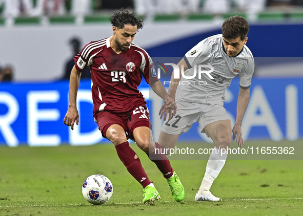 Abdelrahman Fahmi Moustafa of Qatar battles for the ball with Alimardo Shukurov of Kyrgyzstan during the FIFA World Cup 2026 AFC Asian Quali...