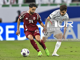 Abdelrahman Fahmi Moustafa of Qatar battles for the ball with Alimardo Shukurov of Kyrgyzstan during the FIFA World Cup 2026 AFC Asian Quali...