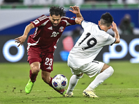 Abdelrahman Fahmi Moustafa of Qatar battles for the ball with Alimardo Shukurov of Kyrgyzstan during the FIFA World Cup 2026 AFC Asian Quali...