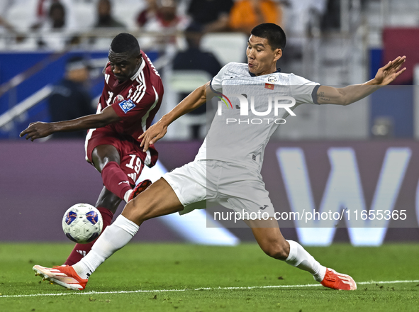 Almoez Ali of Qatar battles for the ball with Tamirlan Kozubaev of Kyrgyzstan during the FIFA World Cup 2026 AFC Asian Qualifiers 3rd round...