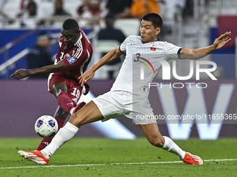 Almoez Ali of Qatar battles for the ball with Tamirlan Kozubaev of Kyrgyzstan during the FIFA World Cup 2026 AFC Asian Qualifiers 3rd round...