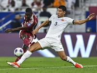 Almoez Ali of Qatar battles for the ball with Tamirlan Kozubaev of Kyrgyzstan during the FIFA World Cup 2026 AFC Asian Qualifiers 3rd round...