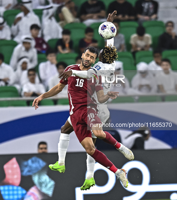 Boualem Khoukhi of Qatar battles for the ball with Joel Kojo of Kyrgyzstan during the FIFA World Cup 2026 AFC Asian Qualifiers 3rd round gro...