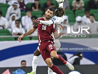 Boualem Khoukhi of Qatar battles for the ball with Joel Kojo of Kyrgyzstan during the FIFA World Cup 2026 AFC Asian Qualifiers 3rd round gro...