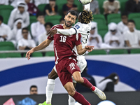 Boualem Khoukhi of Qatar battles for the ball with Joel Kojo of Kyrgyzstan during the FIFA World Cup 2026 AFC Asian Qualifiers 3rd round gro...