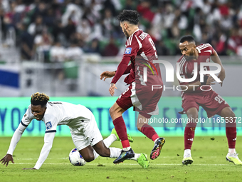 Boualem Khoukhi of Qatar battles for the ball with Edmilson Junior Dasilva of Qatar during the FIFA World Cup 2026 AFC Asian Qualifiers 3rd...