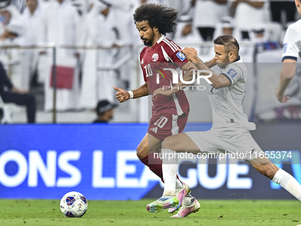 Akram Afif of Qatar battles for the ball with Abdurakhmanov Odilzhon of Kyrgyzstan during the FIFA World Cup 2026 AFC Asian Qualifiers 3rd r...