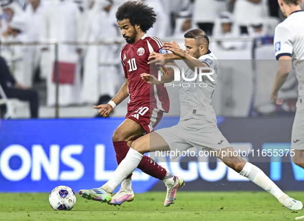 Akram Afif of Qatar battles for the ball with Abdurakhmanov Odilzhon of Kyrgyzstan during the FIFA World Cup 2026 AFC Asian Qualifiers 3rd r...