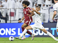 Akram Afif of Qatar battles for the ball with Abdurakhmanov Odilzhon of Kyrgyzstan during the FIFA World Cup 2026 AFC Asian Qualifiers 3rd r...