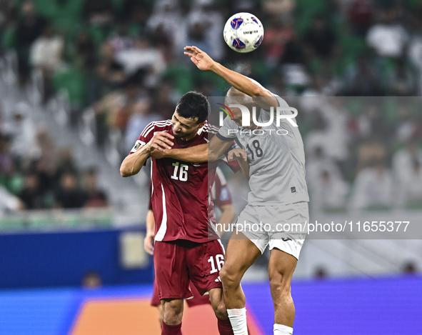 Boualem Khoukhi of Qatar battles for the ball with Kairat Zhyrgalbek Uulu of Kyrgyzstan during the FIFA World Cup 2026 AFC Asian Qualifiers...