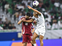 Boualem Khoukhi of Qatar battles for the ball with Kairat Zhyrgalbek Uulu of Kyrgyzstan during the FIFA World Cup 2026 AFC Asian Qualifiers...