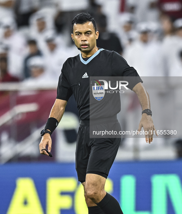 Referee Muhammad Taqi of Singapore gestures during the FIFA World Cup 2026 AFC Asian Qualifiers 3rd round group A match between Qatar and Ky...