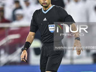 Referee Muhammad Taqi of Singapore gestures during the FIFA World Cup 2026 AFC Asian Qualifiers 3rd round group A match between Qatar and Ky...