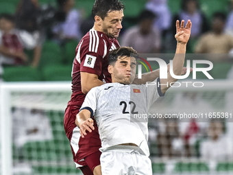 Lucas Mendes of Qatar battles for the ball with Alimardo Shukurov of Kyrgyzstan during the FIFA World Cup 2026 AFC Asian Qualifiers 3rd roun...