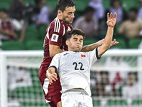 Lucas Mendes of Qatar battles for the ball with Alimardo Shukurov of Kyrgyzstan during the FIFA World Cup 2026 AFC Asian Qualifiers 3rd roun...