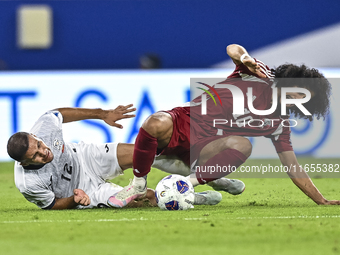 Akram Afif of Qatar battles for the ball with Abdurakhmanov Odilzhon of Kyrgyzstan during the FIFA World Cup 2026 AFC Asian Qualifiers 3rd r...