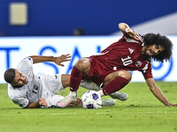 Akram Afif of Qatar battles for the ball with Abdurakhmanov Odilzhon of Kyrgyzstan during the FIFA World Cup 2026 AFC Asian Qualifiers 3rd r...