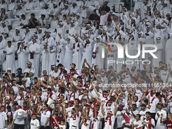 Qatar supporters cheer for their team during the FIFA World Cup 2026 AFC Asian Qualifiers 3rd round group A match between Qatar and Kyrgyzst...