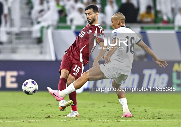 Boualem Khoukhi of Qatar battles for the ball with Kairat Zhyrgalbek Uulu of Kyrgyzstan during the FIFA World Cup 2026 AFC Asian Qualifiers...