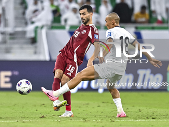 Boualem Khoukhi of Qatar battles for the ball with Kairat Zhyrgalbek Uulu of Kyrgyzstan during the FIFA World Cup 2026 AFC Asian Qualifiers...