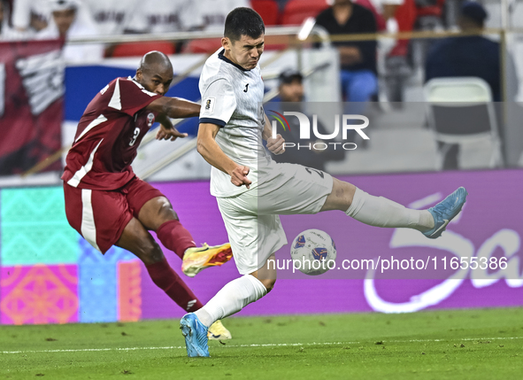 Abdelkarim Hassan of Qatar battles for the ball with Zarypbbekov Eldiiar of Kyrgyzstan during the FIFA World Cup 2026 AFC Asian Qualifiers 3...