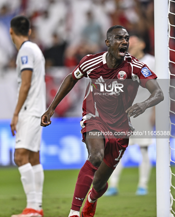 Almoez Ali of Qatar celebrates after scoring the opening goal during the FIFA World Cup 2026 AFC Asian Qualifiers 3rd round group A match be...