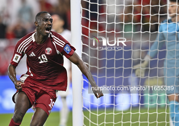 Almoez Ali of Qatar celebrates after scoring the opening goal during the FIFA World Cup 2026 AFC Asian Qualifiers 3rd round group A match be...