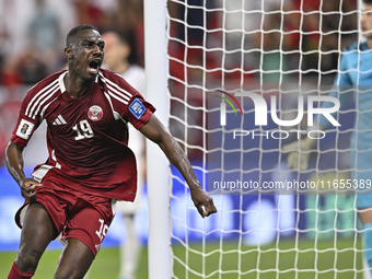 Almoez Ali of Qatar celebrates after scoring the opening goal during the FIFA World Cup 2026 AFC Asian Qualifiers 3rd round group A match be...