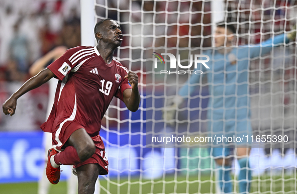 Almoez Ali of Qatar celebrates after scoring the opening goal during the FIFA World Cup 2026 AFC Asian Qualifiers 3rd round group A match be...