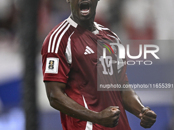 Almoez Ali of Qatar celebrates after scoring the opening goal during the FIFA World Cup 2026 AFC Asian Qualifiers 3rd round group A match be...